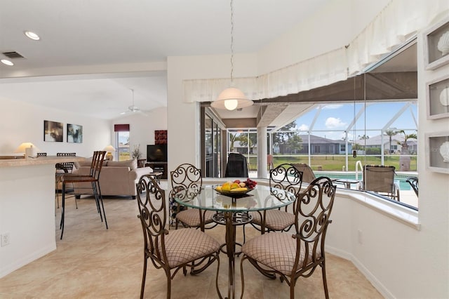 dining room with a sunroom, a ceiling fan, baseboards, recessed lighting, and visible vents