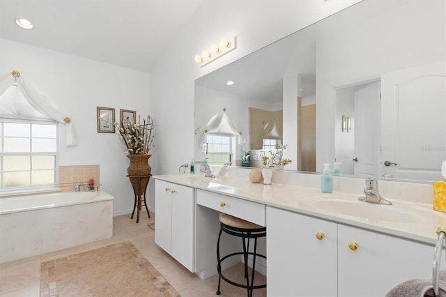 full bath with a sink, a bath, a healthy amount of sunlight, and tile patterned floors
