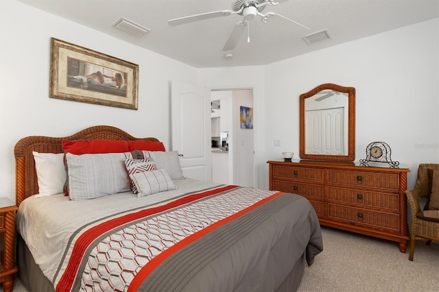 bedroom featuring visible vents, carpet, and ceiling fan