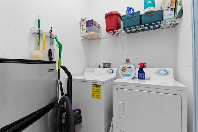 clothes washing area with laundry area and independent washer and dryer