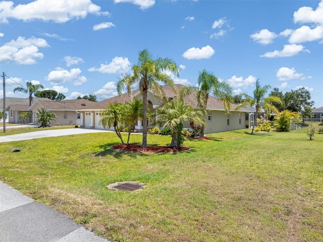 ranch-style house with an attached garage, stucco siding, driveway, and a front lawn