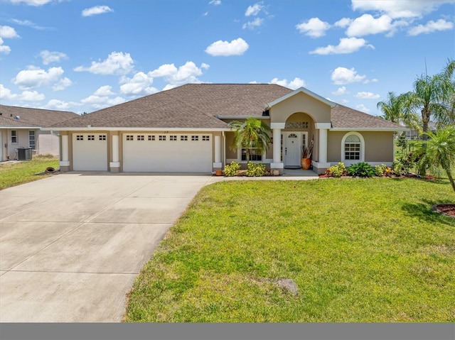 view of front of house featuring roof with shingles, a front yard, concrete driveway, an attached garage, and stucco siding