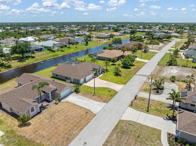 aerial view with a water view and a residential view