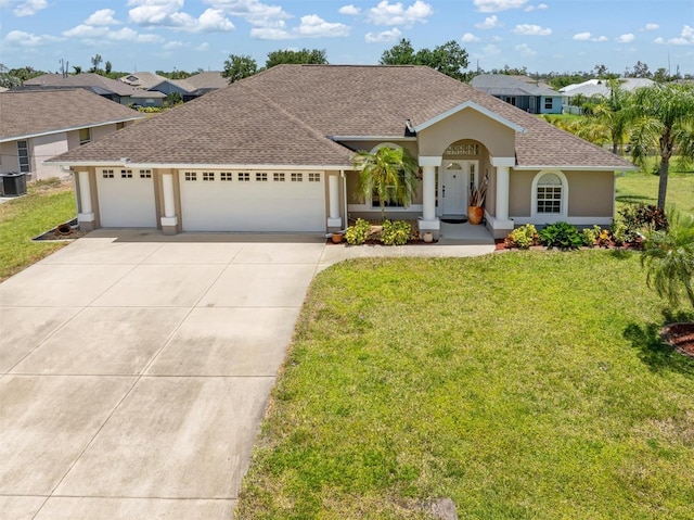 view of front of property featuring a garage, a front yard, stucco siding, a shingled roof, and concrete driveway