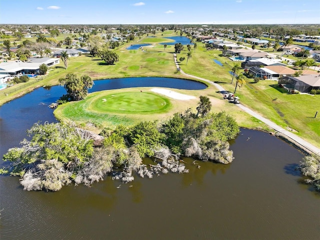birds eye view of property featuring a water view, golf course view, and a residential view