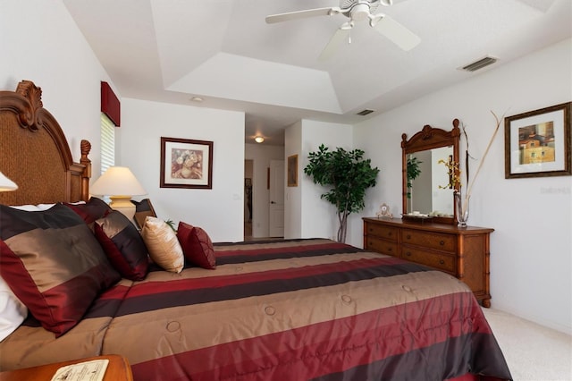 39 Medalist Ln, Rotonda West, FL 33947 - carpeted bedroom with a tray ceiling and a ceiling fan