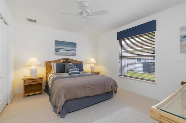 39 Medalist Ln, Rotonda West, FL 33947 - carpeted bedroom with baseboards, ceiling fan, and a closet