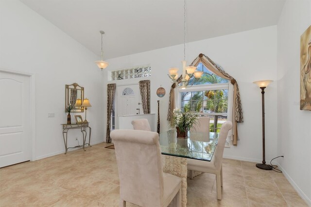 39 Medalist Ln, Rotonda West, FL 33947 - dining area featuring a chandelier, light tile patterned flooring, baseboards, and a high ceiling