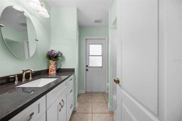 full bathroom with vanity, visible vents, and tile patterned floors