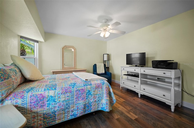 bedroom with baseboards, a ceiling fan, and wood finished floors