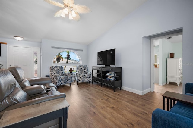 living room with a ceiling fan, baseboards, visible vents, high vaulted ceiling, and hardwood / wood-style flooring