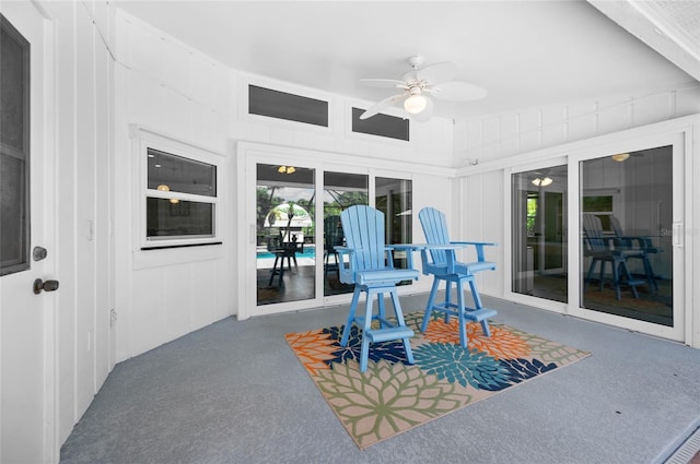 exterior space featuring ceiling fan