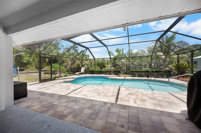 pool with a patio and glass enclosure