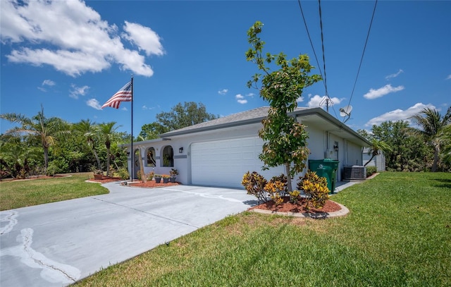 view of property exterior featuring a lawn, central AC unit, driveway, and a garage