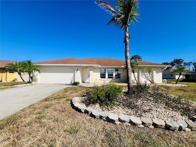 1155 Osceola Blvd, Englewood, FL 34223 - ranch-style house with concrete driveway, stucco siding, and a garage