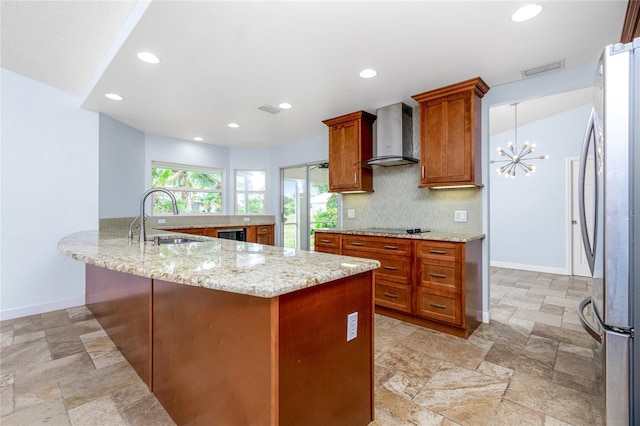 1155 Osceola Blvd, Englewood, FL 34223 - kitchen with freestanding refrigerator, brown cabinetry, stone tile floors, and wall chimney exhaust hood