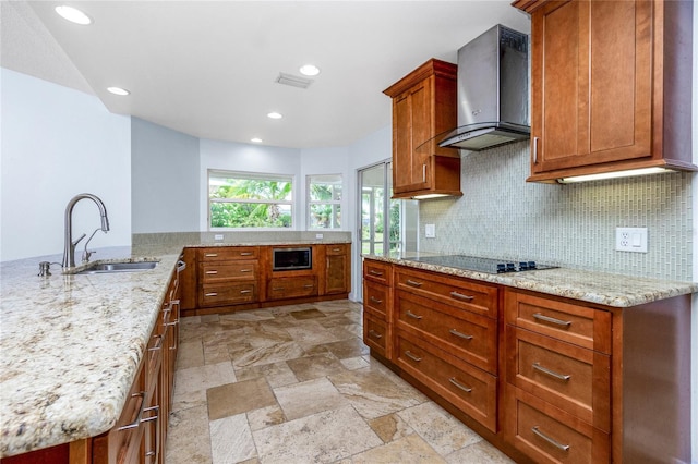 1155 Osceola Blvd, Englewood, FL 34223 - kitchen with a sink, wall chimney range hood, black electric stovetop, backsplash, and built in microwave