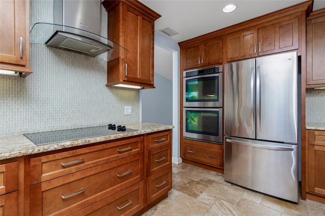 1155 Osceola Blvd, Englewood, FL 34223 - kitchen featuring wall chimney range hood, appliances with stainless steel finishes, visible vents, and backsplash