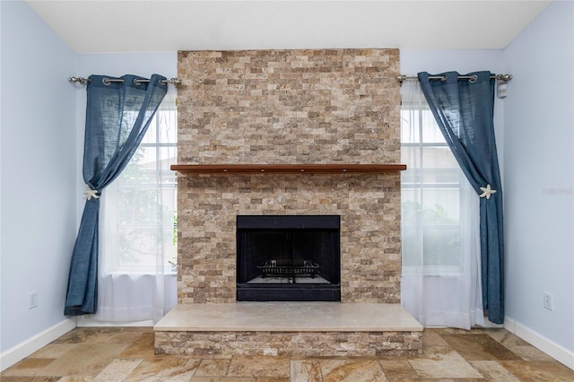 1155 Osceola Blvd, Englewood, FL 34223 - room details featuring baseboards and a fireplace with raised hearth