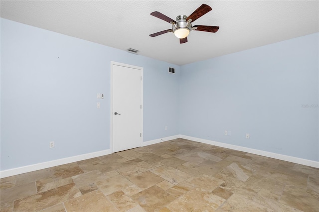 1155 Osceola Blvd, Englewood, FL 34223 - unfurnished room featuring a ceiling fan, baseboards, stone finish floor, and visible vents