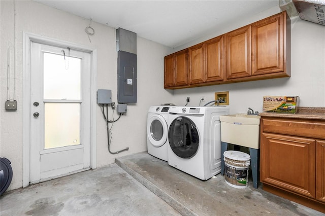1155 Osceola Blvd, Englewood, FL 34223 - clothes washing area featuring electric panel, washer and clothes dryer, and cabinet space