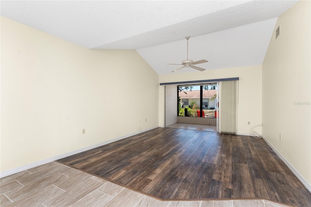 6796 Gasparilla Pines Blvd Unit 63, Englewood, FL 34224 - empty room featuring baseboards, ceiling fan, wood finished floors, and vaulted ceiling
