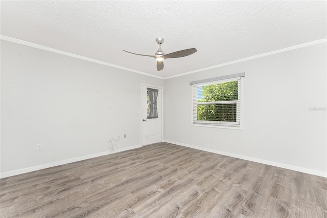 6796 Gasparilla Pines Blvd Unit 63, Englewood, FL 34224 - unfurnished room with crown molding, a textured ceiling, ceiling fan, and wood finished floors