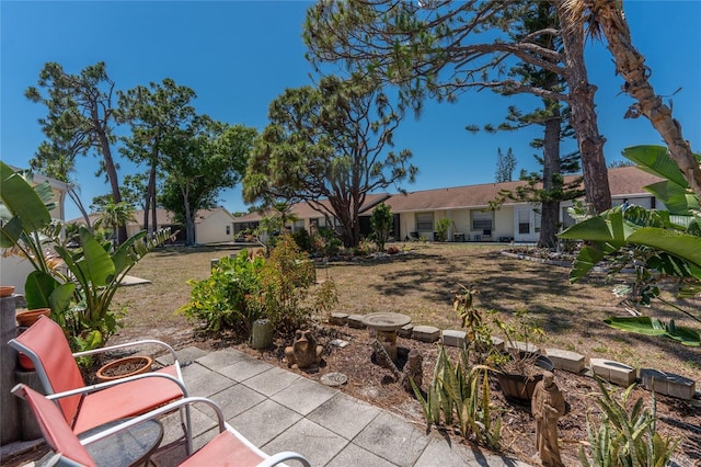 6796 Gasparilla Pines Blvd Unit 63, Englewood, FL 34224 - view of yard with a patio area