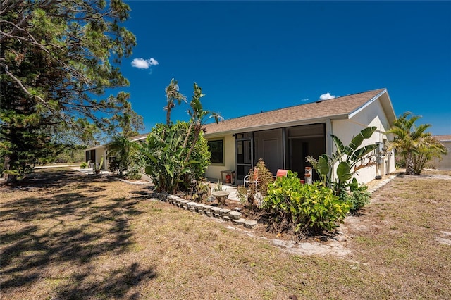 6796 Gasparilla Pines Blvd Unit 63, Englewood, FL 34224 - back of property with a yard and a sunroom