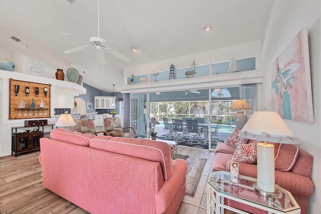 11 Amberjack Ln, Placida, FL 33946 - living area featuring vaulted ceiling, a ceiling fan, wood finished floors, and visible vents