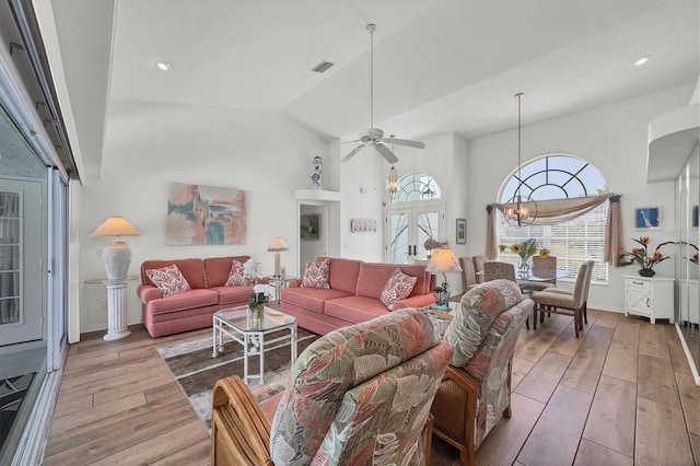 11 Amberjack Ln, Placida, FL 33946 - living area featuring visible vents, wood-type flooring, a wealth of natural light, and high vaulted ceiling