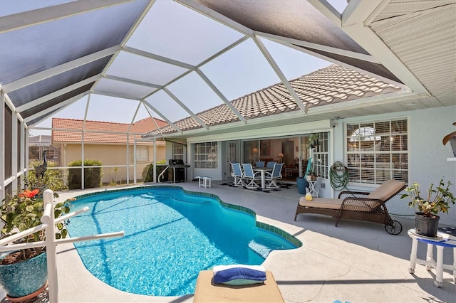 11 Amberjack Ln, Placida, FL 33946 - pool with a patio, outdoor dining area, glass enclosure, and grilling area