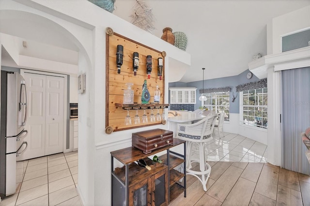 11 Amberjack Ln, Placida, FL 33946 - hallway featuring arched walkways and light tile patterned flooring