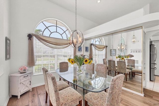 11 Amberjack Ln, Placida, FL 33946 - dining room with an inviting chandelier, light wood-style floors, and a wealth of natural light