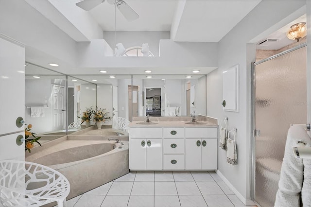 11 Amberjack Ln, Placida, FL 33946 - full bathroom with ceiling fan, double vanity, tile patterned floors, a shower stall, and a bath