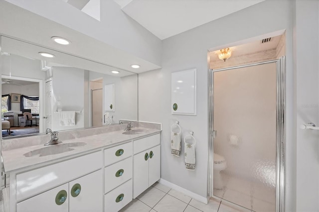 11 Amberjack Ln, Placida, FL 33946 - ensuite bathroom featuring double vanity, a shower stall, a sink, tile patterned floors, and recessed lighting