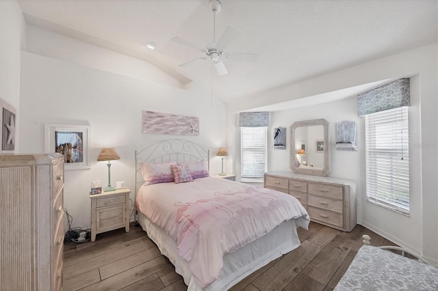 11 Amberjack Ln, Placida, FL 33946 - bedroom featuring multiple windows, a ceiling fan, vaulted ceiling, and wood finished floors