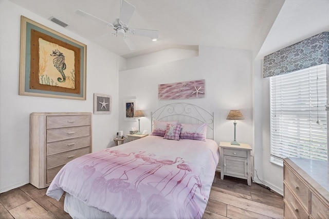 11 Amberjack Ln, Placida, FL 33946 - bedroom with multiple windows, wood finished floors, and visible vents