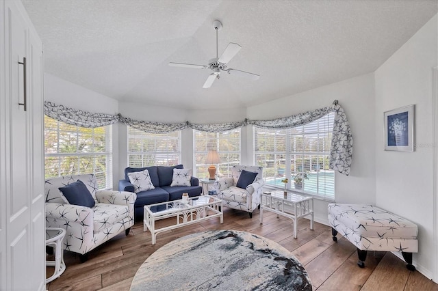 11 Amberjack Ln, Placida, FL 33946 - interior space featuring baseboards, a ceiling fan, a textured ceiling, and wood finished floors