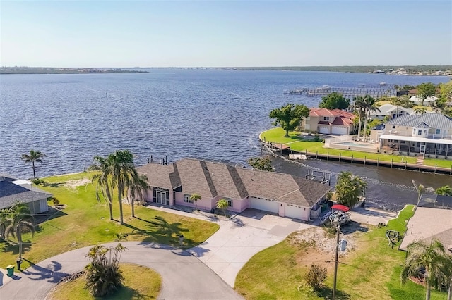 drone / aerial view featuring a water view and a residential view