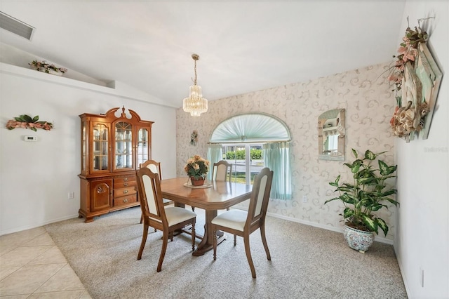 dining room with an inviting chandelier, baseboards, wallpapered walls, lofted ceiling, and visible vents