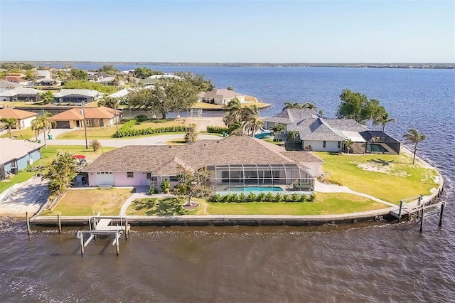 bird's eye view featuring a water view and a residential view