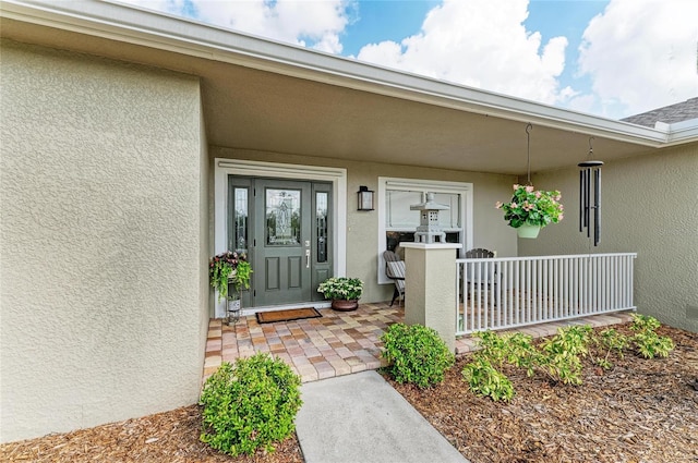 9211 Koma St, Port Charlotte, FL 33981 - property entrance with stucco siding