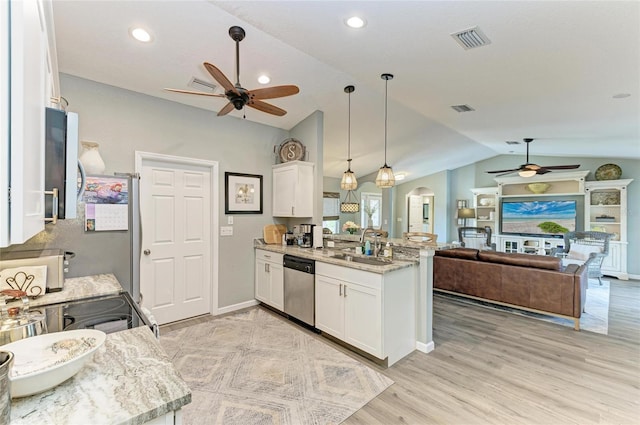 9211 Koma St, Port Charlotte, FL 33981 - kitchen with a ceiling fan, lofted ceiling, dishwasher, a peninsula, and arched walkways