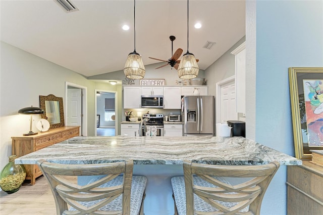 9211 Koma St, Port Charlotte, FL 33981 - kitchen with ceiling fan, white cabinetry, visible vents, and appliances with stainless steel finishes