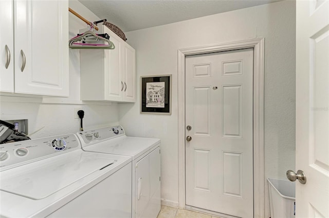 9211 Koma St, Port Charlotte, FL 33981 - clothes washing area featuring separate washer and dryer, cabinet space, and light tile patterned floors