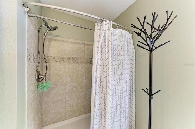 9211 Koma St, Port Charlotte, FL 33981 - full bath with a shower with curtain and a textured wall