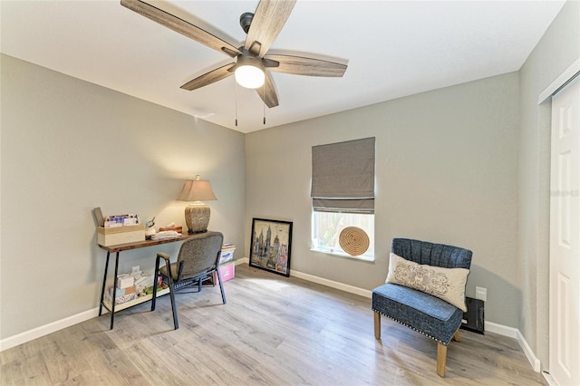 9211 Koma St, Port Charlotte, FL 33981 - living area with baseboards, ceiling fan, and wood finished floors