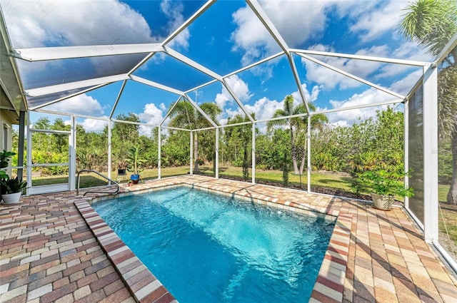 9211 Koma St, Port Charlotte, FL 33981 - pool featuring glass enclosure and a patio