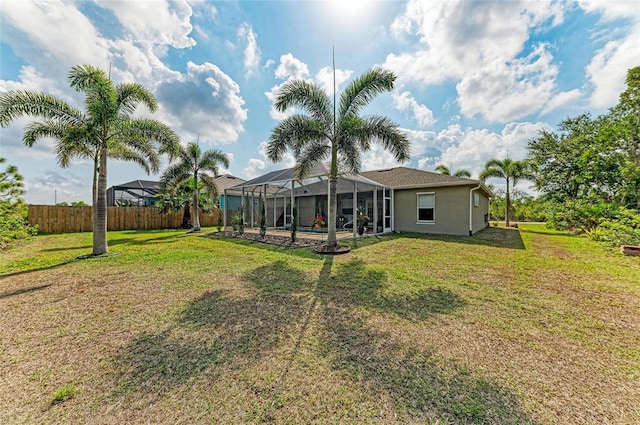 9211 Koma St, Port Charlotte, FL 33981 - view of yard featuring glass enclosure and fence